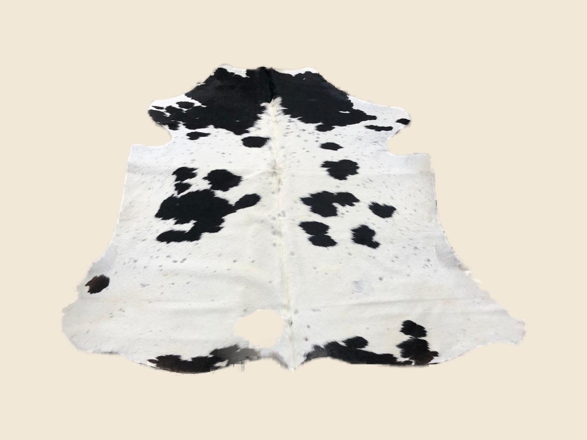 Black and white cowhide rug