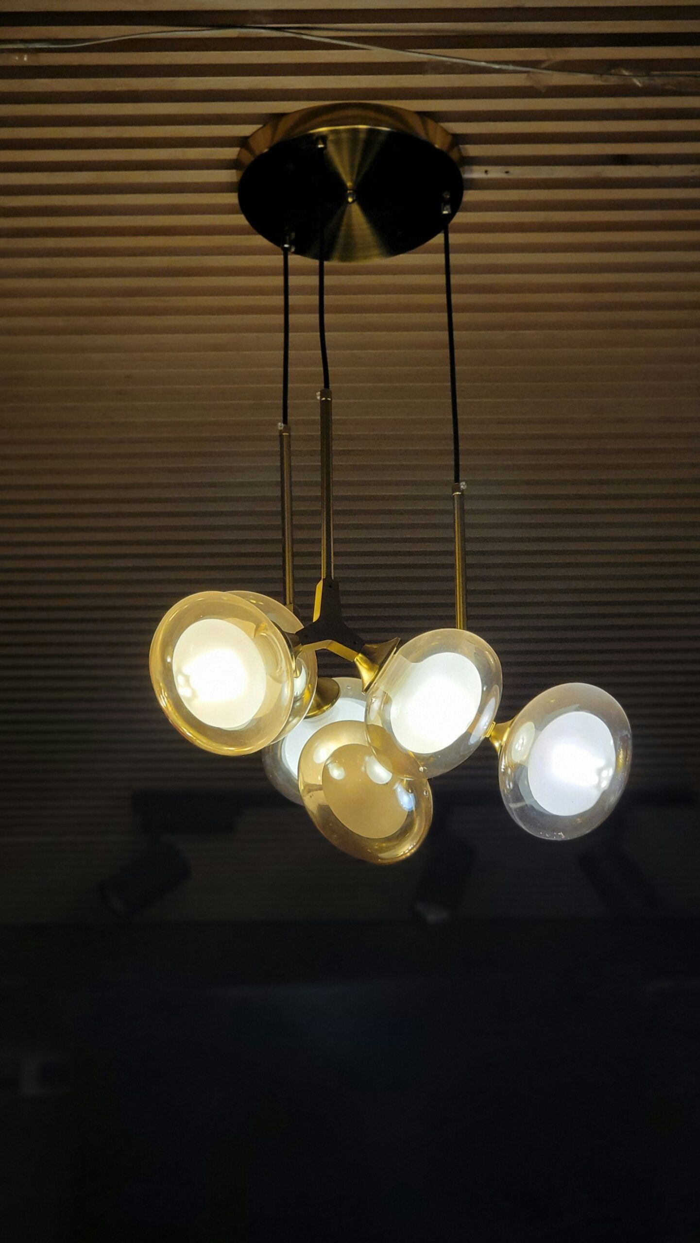 Brass chandelier with glass globes Brass chandelier with glass globes