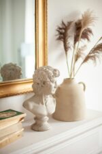 Classical bust beside a vase