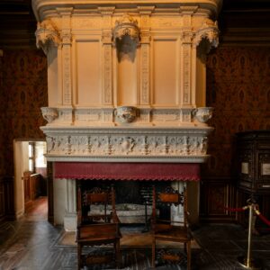 Carved stone fireplace mantel
