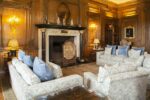 Classic marble fireplace in a paneled room