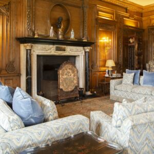 Classic marble fireplace in a paneled room