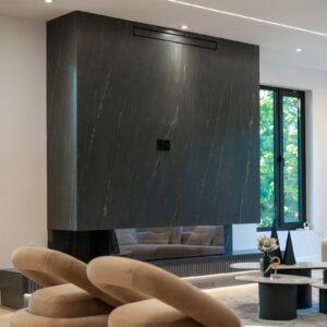 Dark marble fireplace with chairs